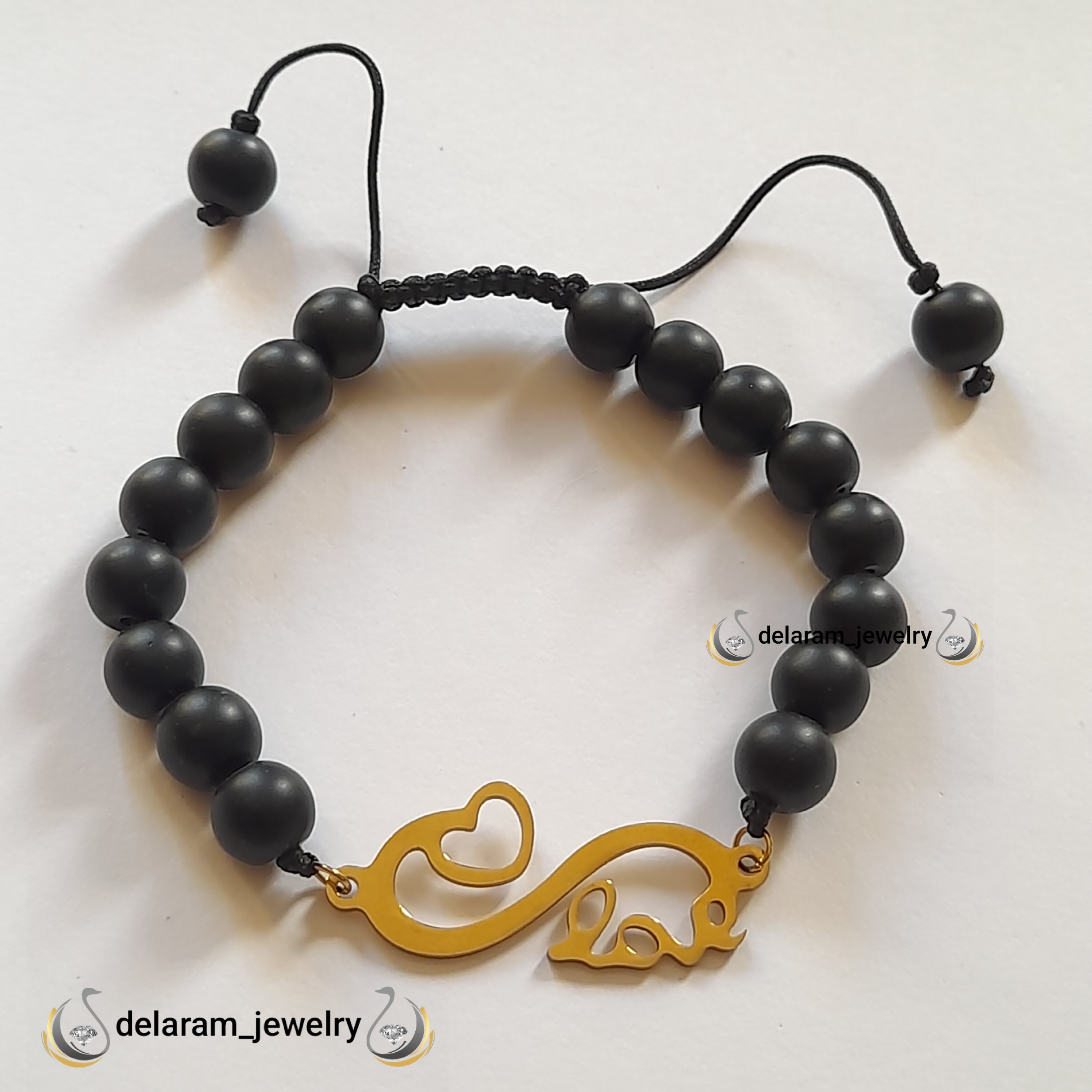 دستبند اونیکس مشکی  مات پلا ک استیل قلب و لاو نخ محکم 