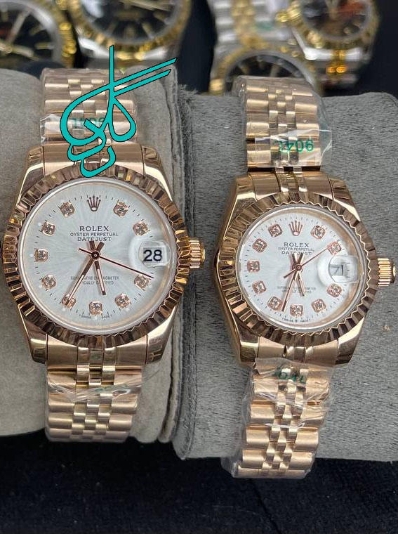 خرید ست ساعت زنانه و مردانه رولکس موتور ژاپن رنگ رزرگلد ایندکس خطی کیفیت عالی رنگ ثابت سایز کوچک کد 2116101 - ردگل