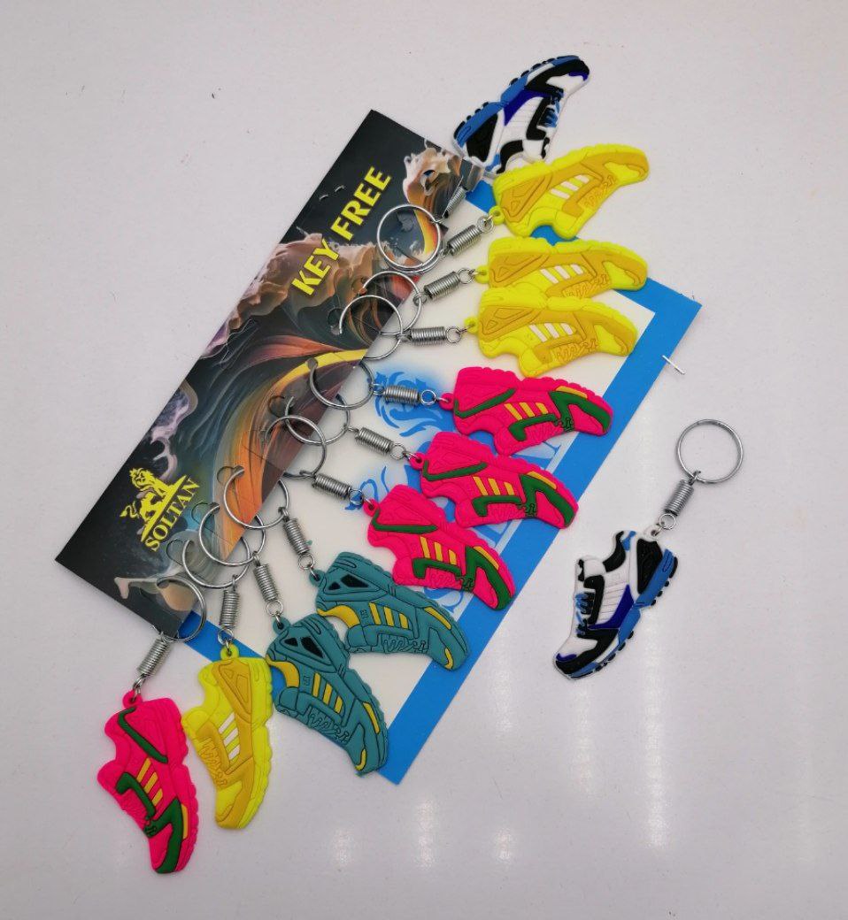 سرکلیدی سیلیکونی کفش کتانی فنری