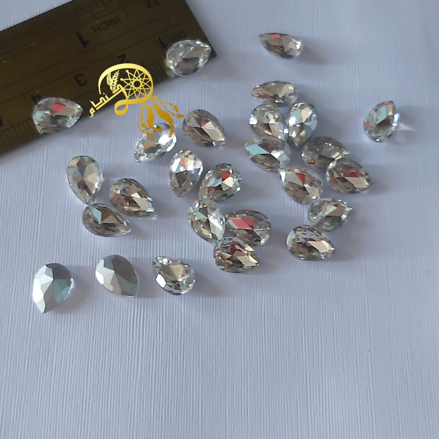 نگین سنگی مدل اشکی کوچک حدودیک سانتی بسته ده عددی