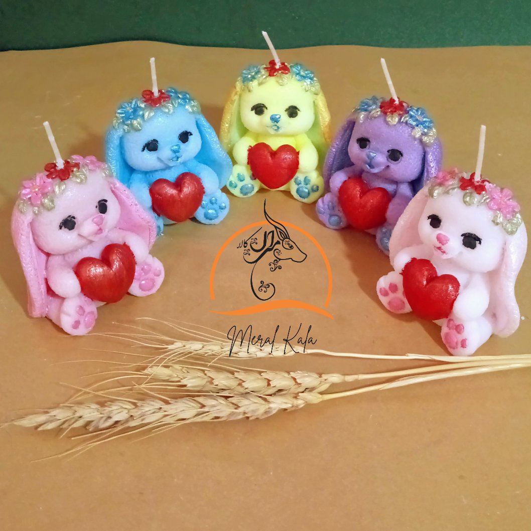 شمع خرگوش نماد ثروت رنگبندی سفید صورتی آبی یاسی زرد روشن