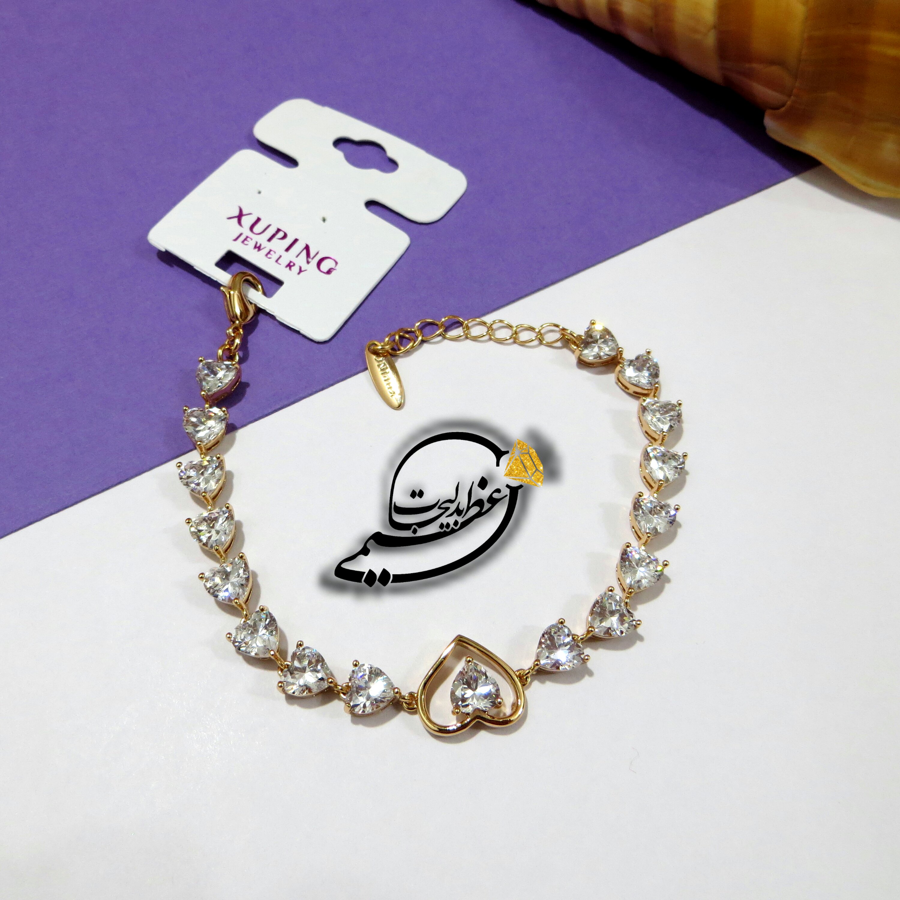دستبند  نگین کاری سفید قلبی شیک و  بسیار زیبای برند Xuping از جنس مس و روکش طلا  و رنگ ثابت و ضد حساسیت کاملا مشابه طلا 