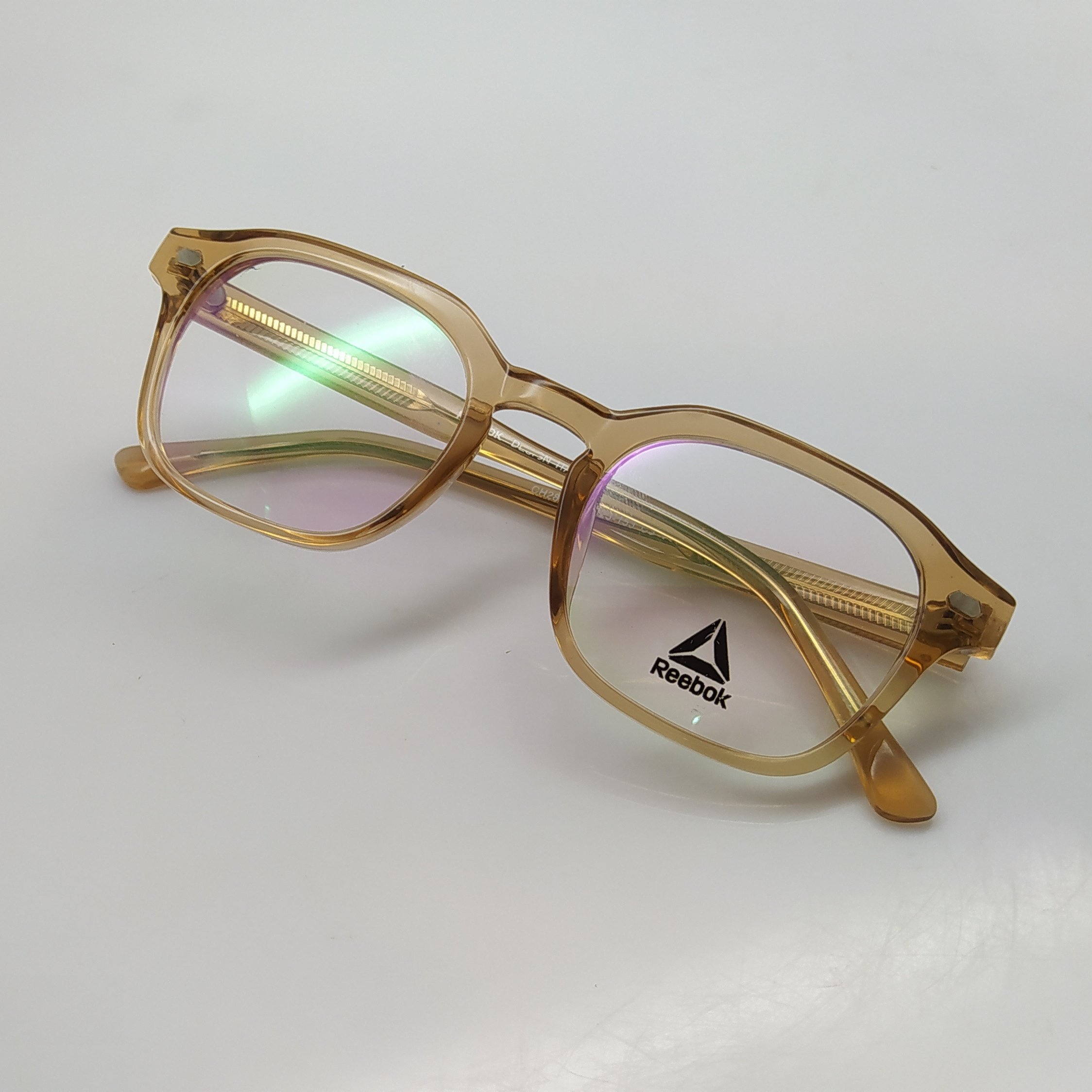 عینک طبی برند ریبوک جنس فریم تمام قاب کائوچو داخل دسته فلز
