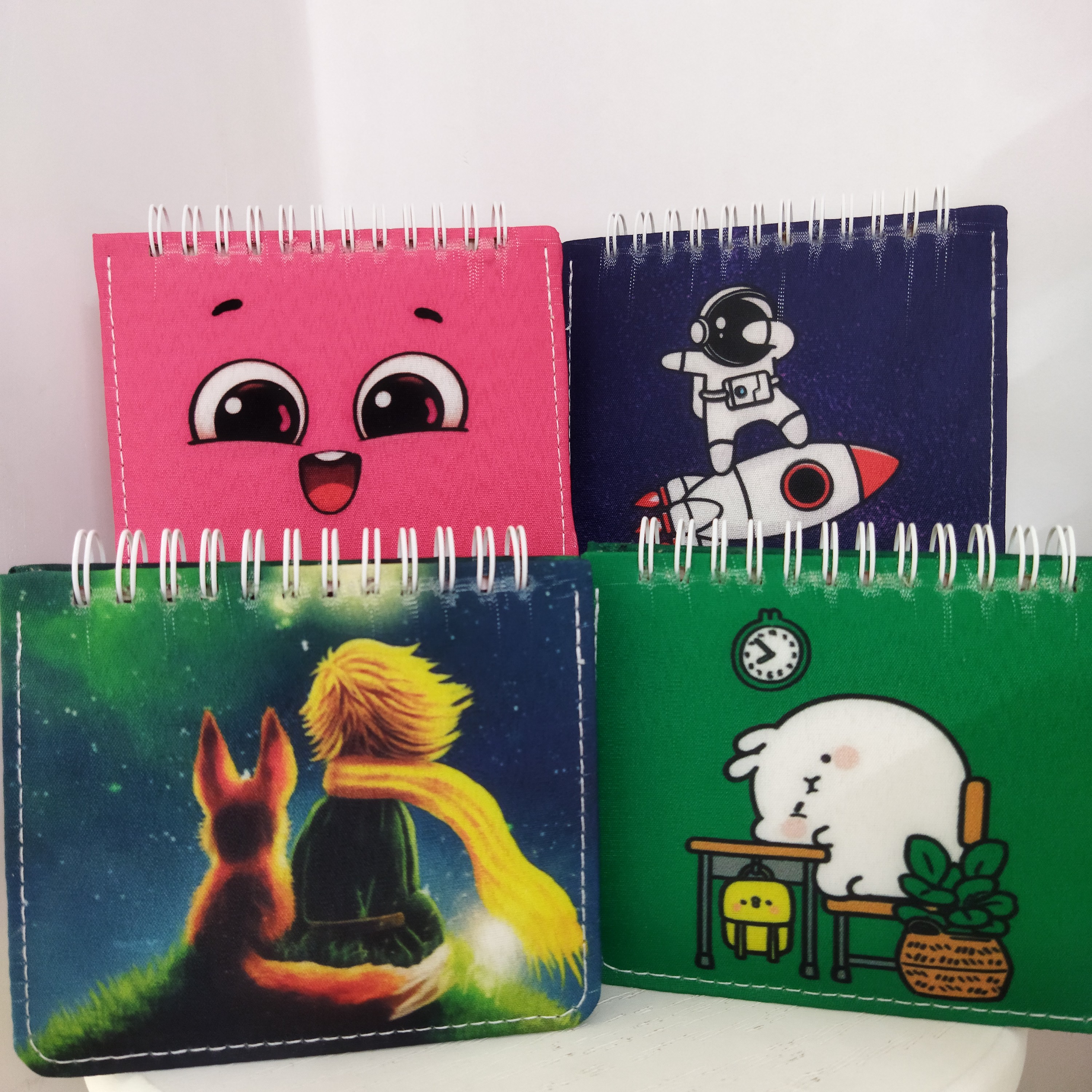 دفترچه  با جلد پارچه ای طرح های فانتزی کد 005 (بسته ده عددی)