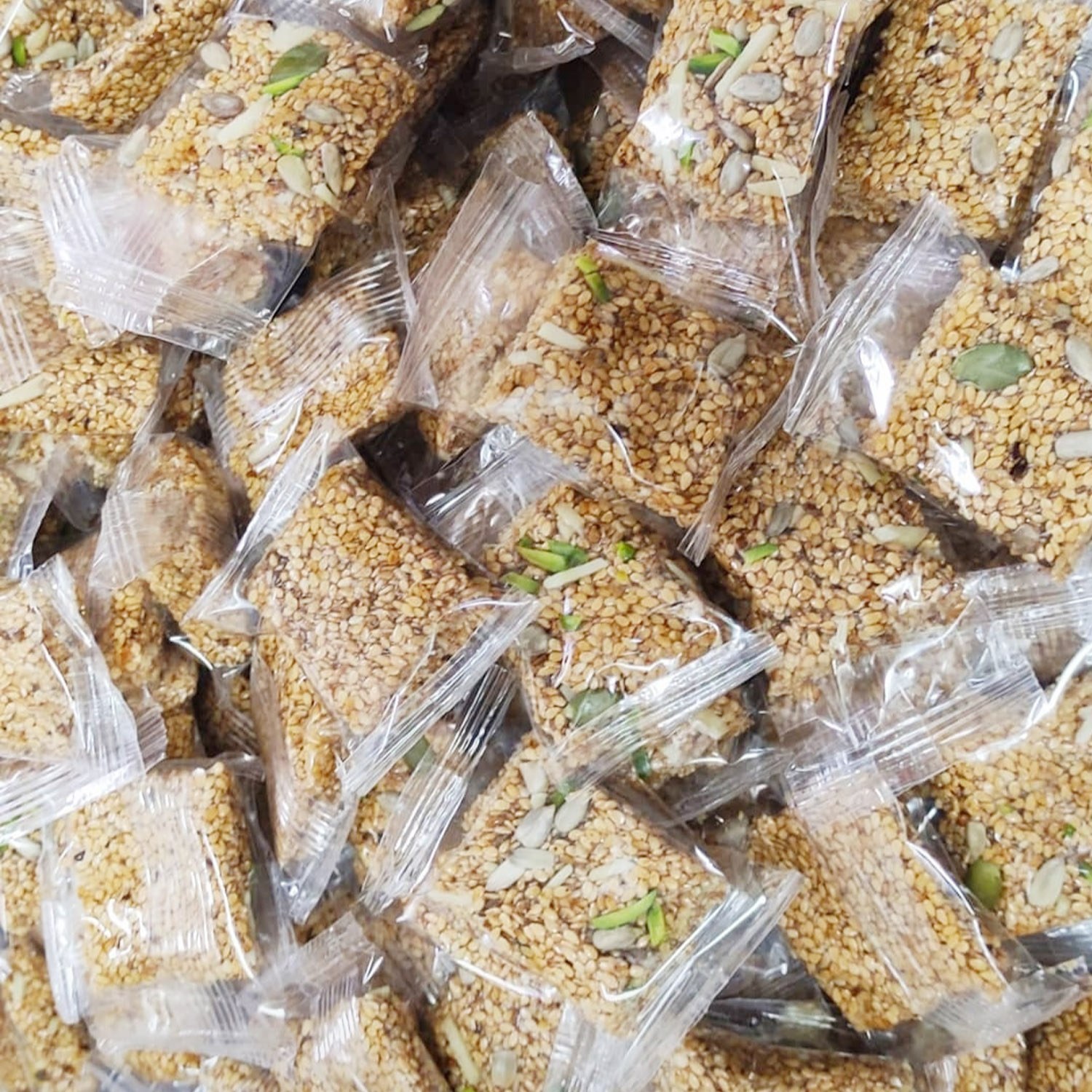 کنجد عسلی سفید عمده (4500گرم) شیرینی کنجدی کنجد بار سوغات دزفول 