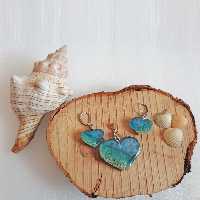 نیم ست زیورآلات طرح دریای آرام
جنس رزین 
رنگ آبی و طرح کف دریا
طرح به صورت قلب
تمام وسایل نیم ست به رنگ نقره ای است.