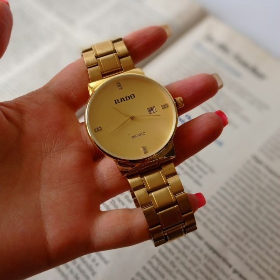 ساعت مچی زنانه یا مردانه دخترانه پسرانه برند رادو  بند استیل طلایی صفحه طلایی شیشه برجسته تقویم دار ارسال رایگان باکیفیت