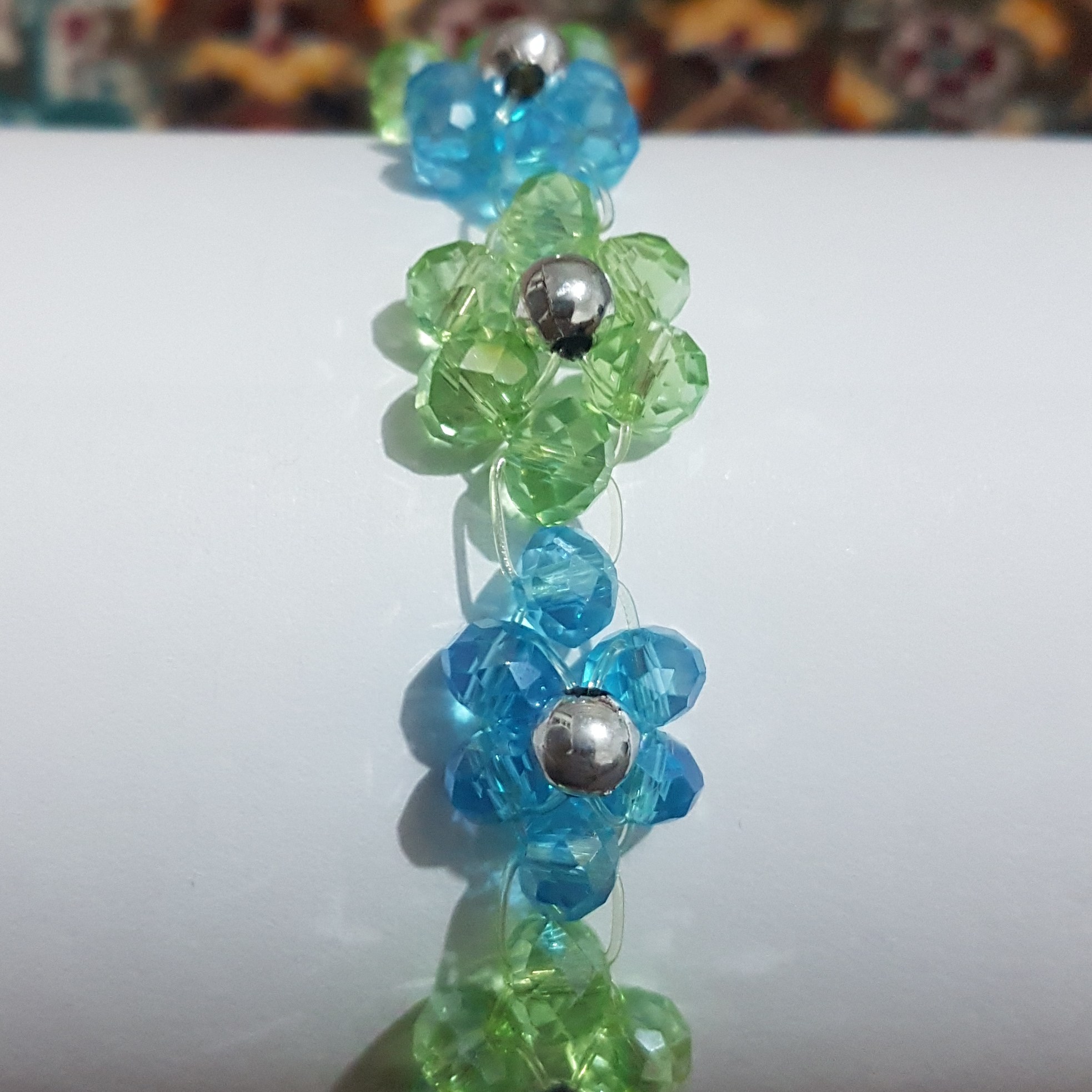 دستبند منجوق دار طرح گل