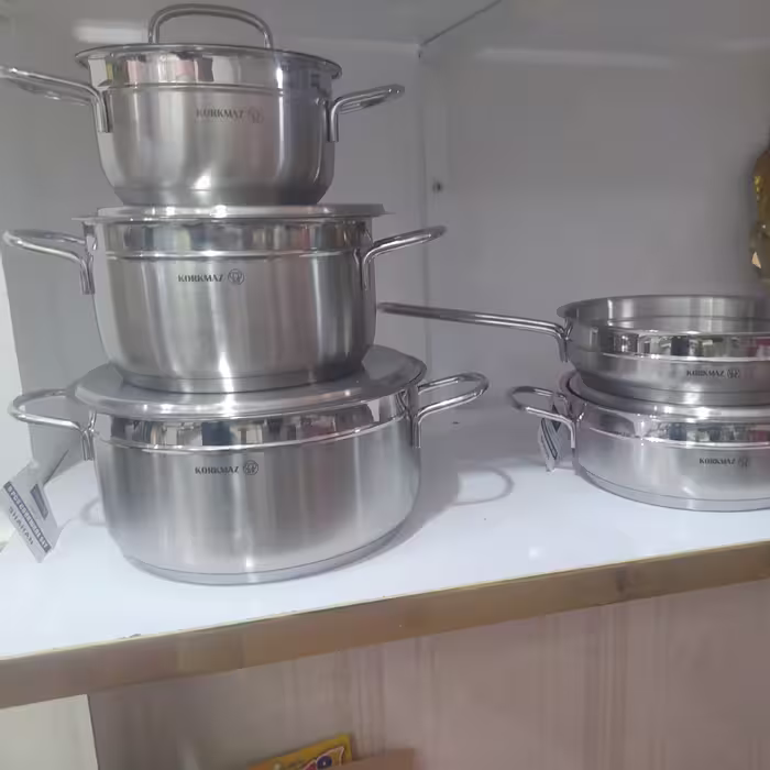 سرویس قابلمه 9پارچه استیل کرکماز (ساخت ترکیه )حک شدن کف چدن