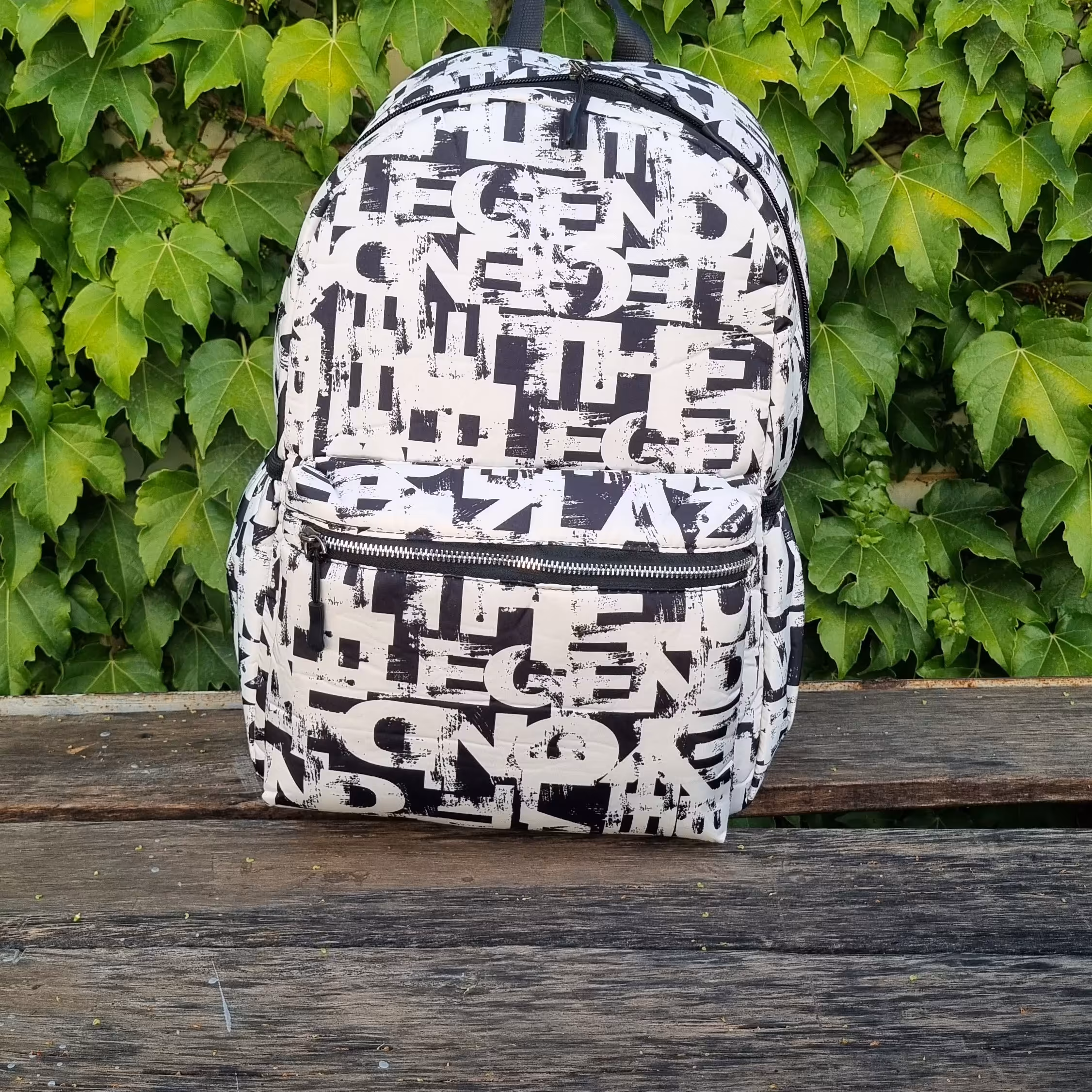 کوله پشتی مدرسه وارداتی مشکی سفید با طرح انگلیسی روزنامه ای 