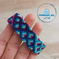 دستبند دوستی دستبافت طرح ترگل ورگل ( بنفش و سرخابی و آبی) محصول کاملا دستساز تیم گوزن آبی