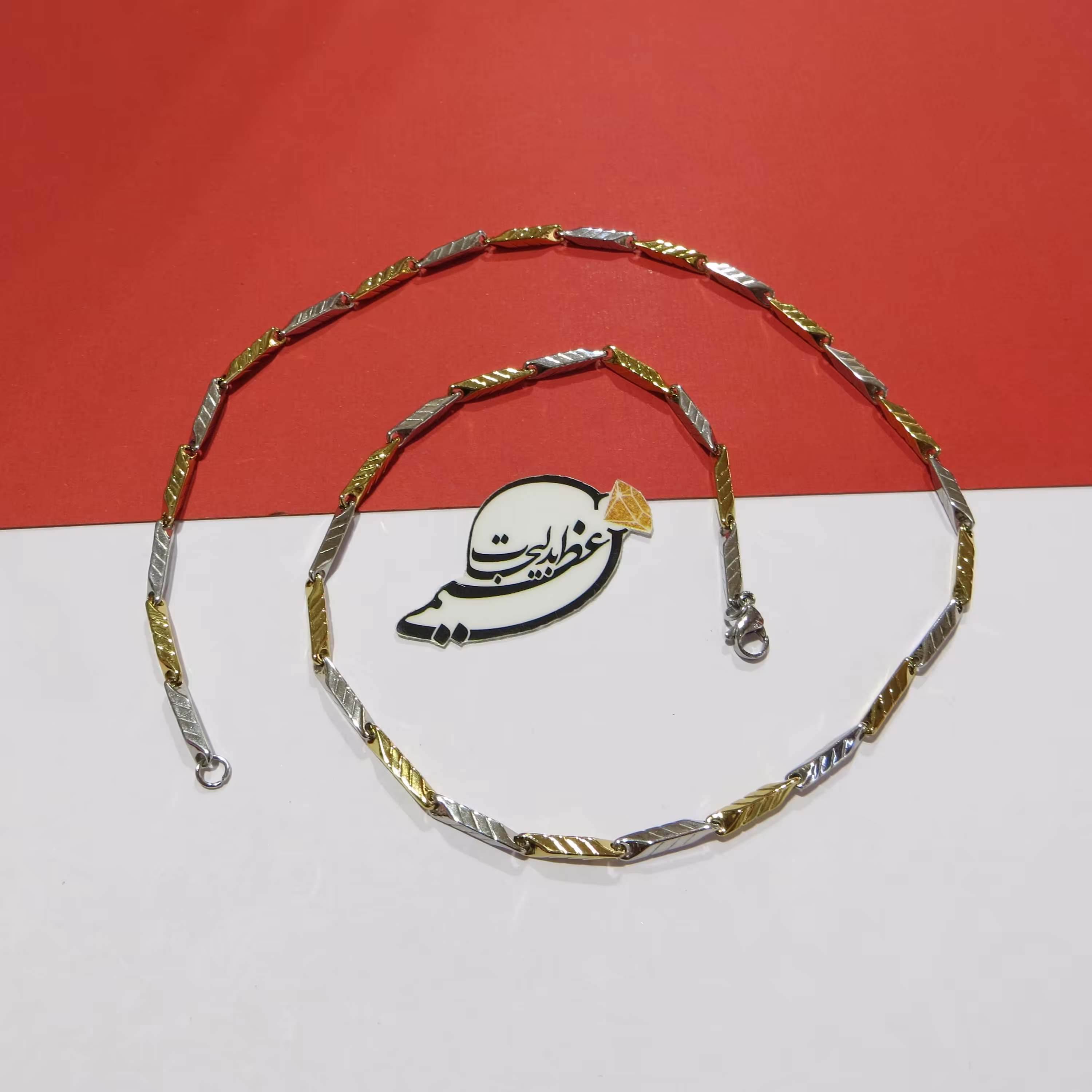 گردنبند کبریتی زیبا  دو رنگ طلایی و نقره ای از جنس استیل رنگ ثابت هاشور خورده