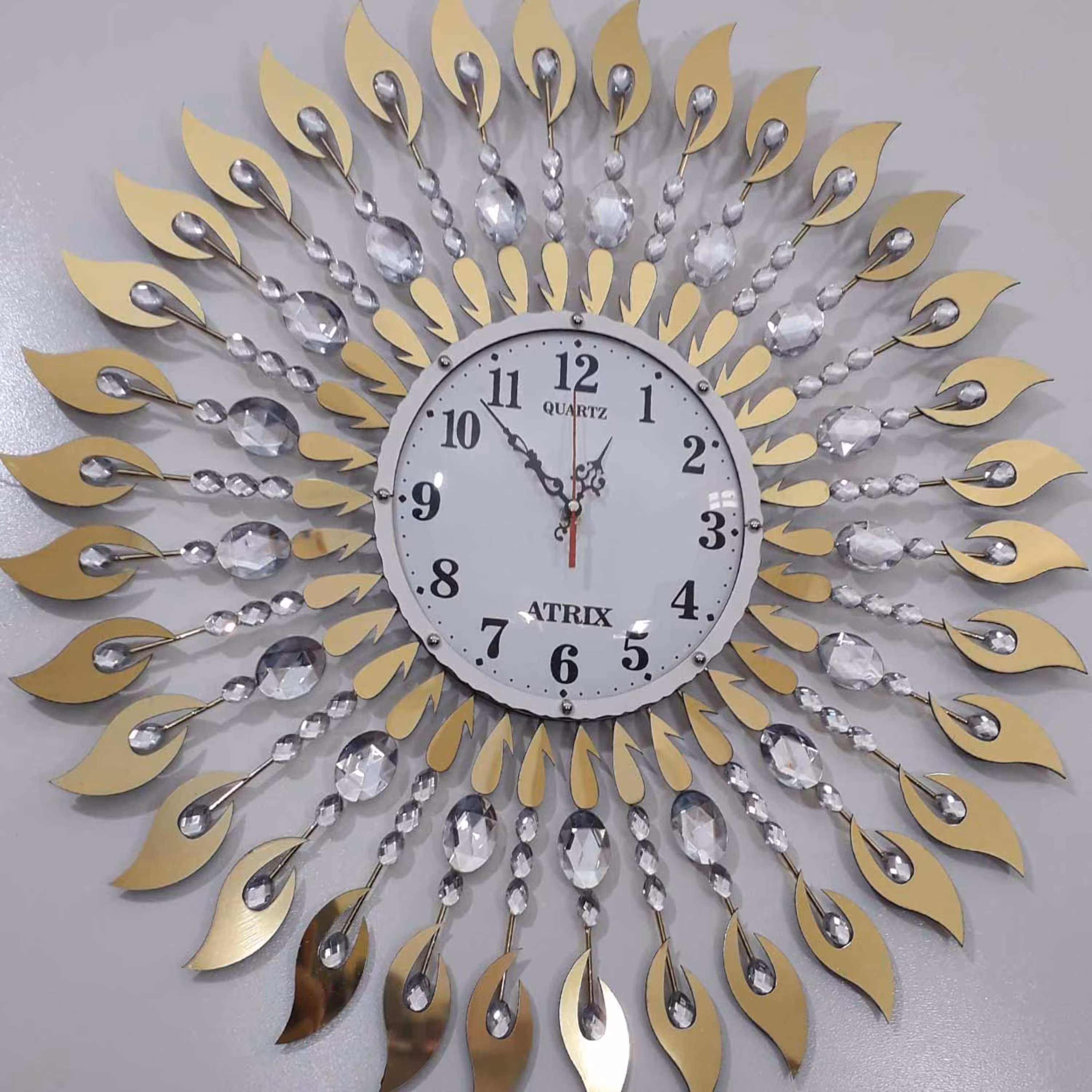 ساعت دیواری پدیده پلاس مدل نگین دار خورشیدی کد102