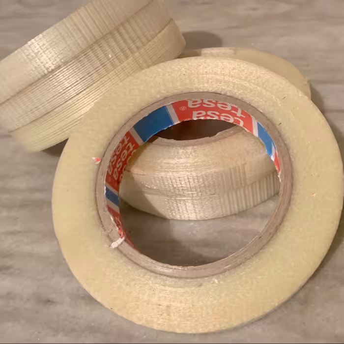 چسب شیشه ای الیافدار عرض 10 میلیمتر و طول 25 متر مدل TESA