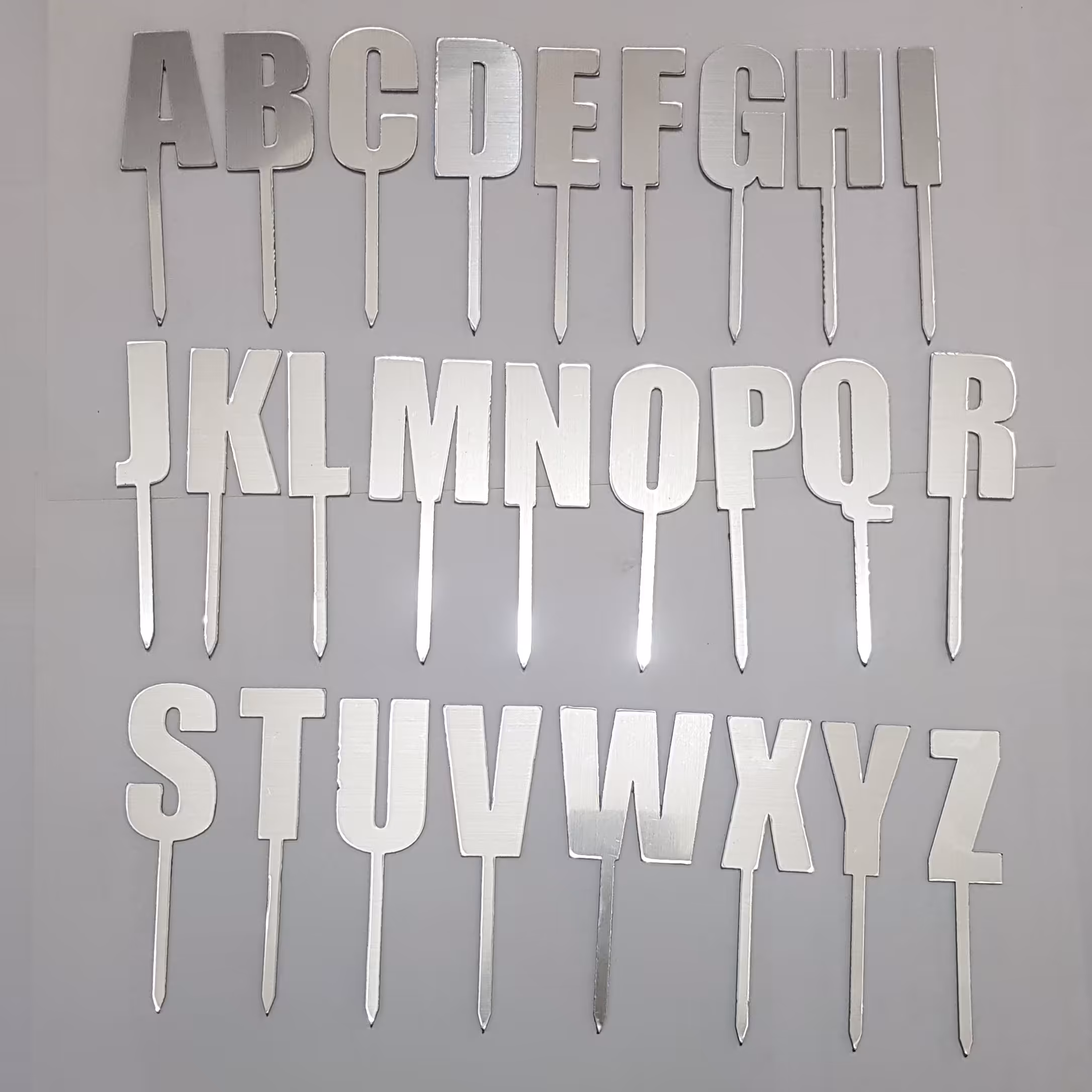 مجموعه 26 تایی تاپر کیک تولد حروف انگلیسی از A تا Z، مولتی استایل نقره ای، مدل 002