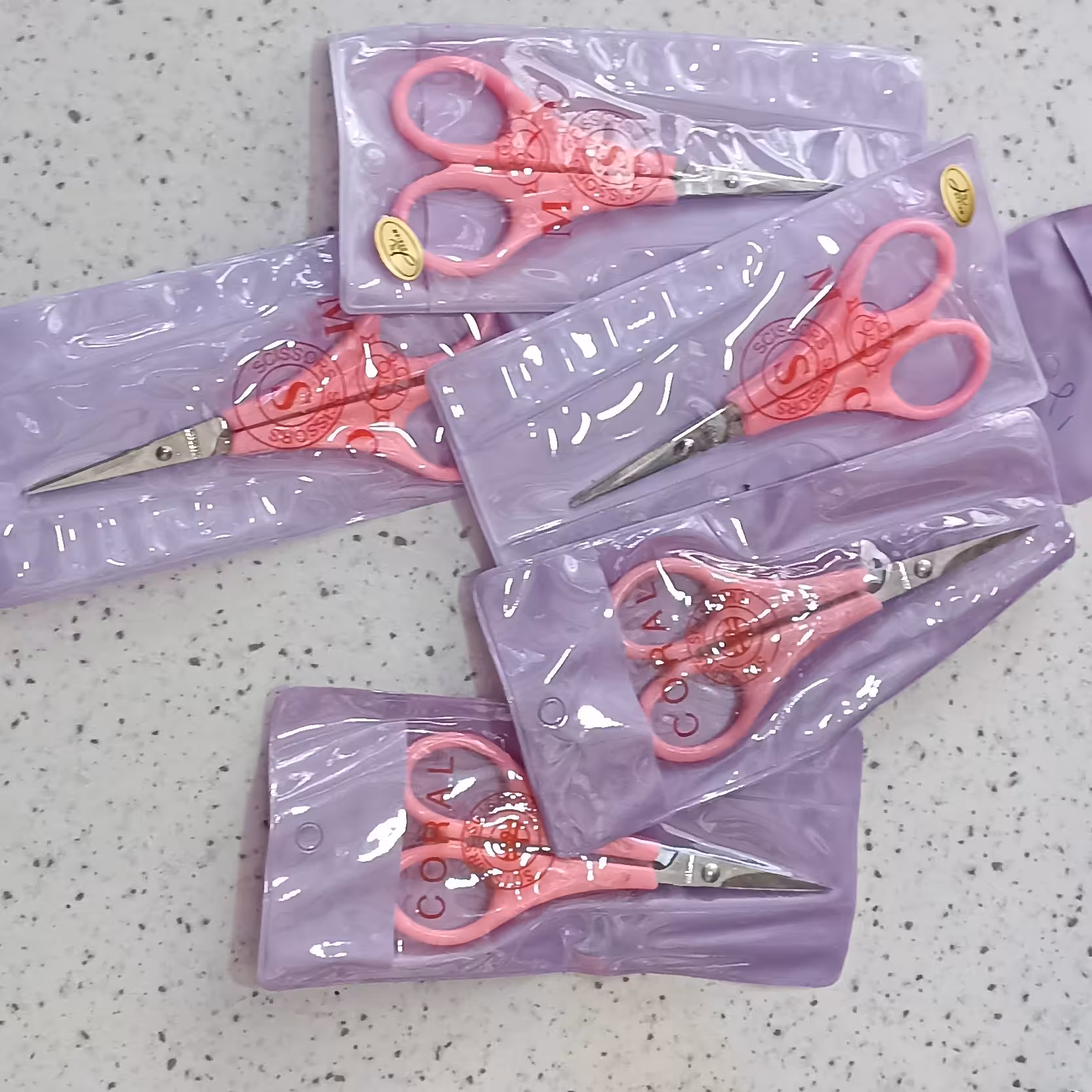 قیچی ابروی دسته صورتی  پک 12عددی 