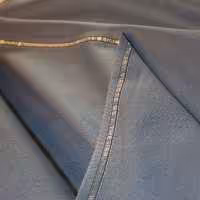 پارچه شلوار فاستونی سیناتکس فام ترکیبی آبی تیره و آبی روشن - طرح فیلافیل - قواره 1.20 متر