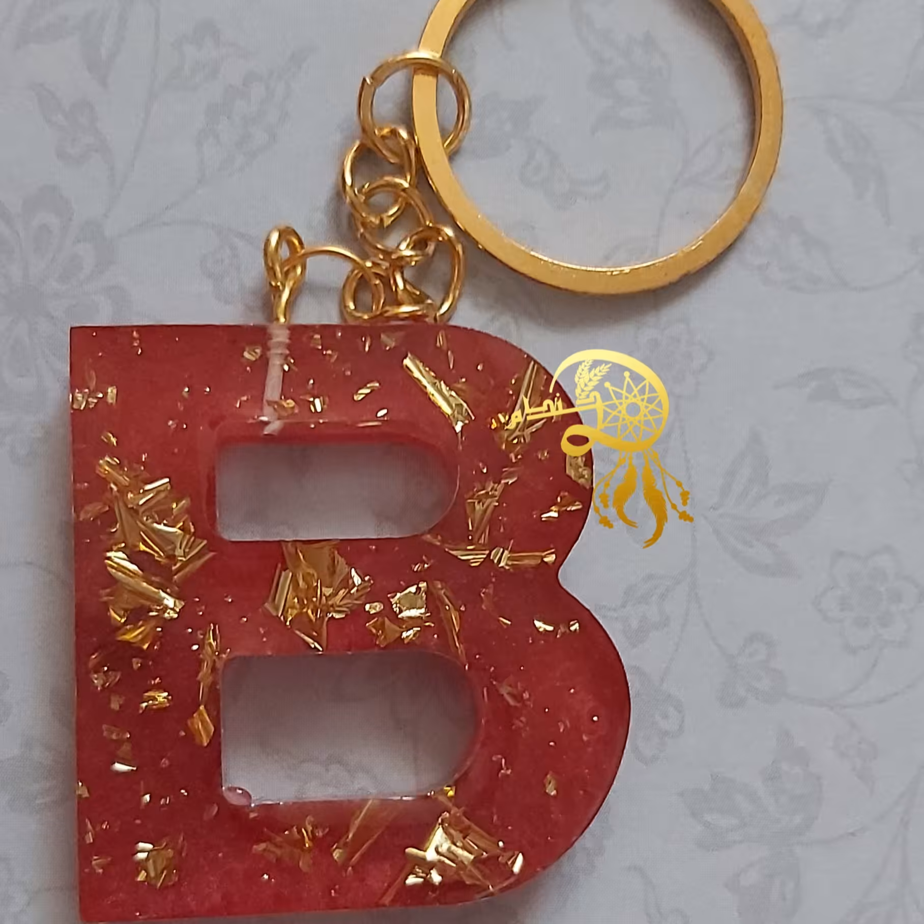 جاکلیدی رزینی حرفB رنگ قرمز باورق طلا یک عدد