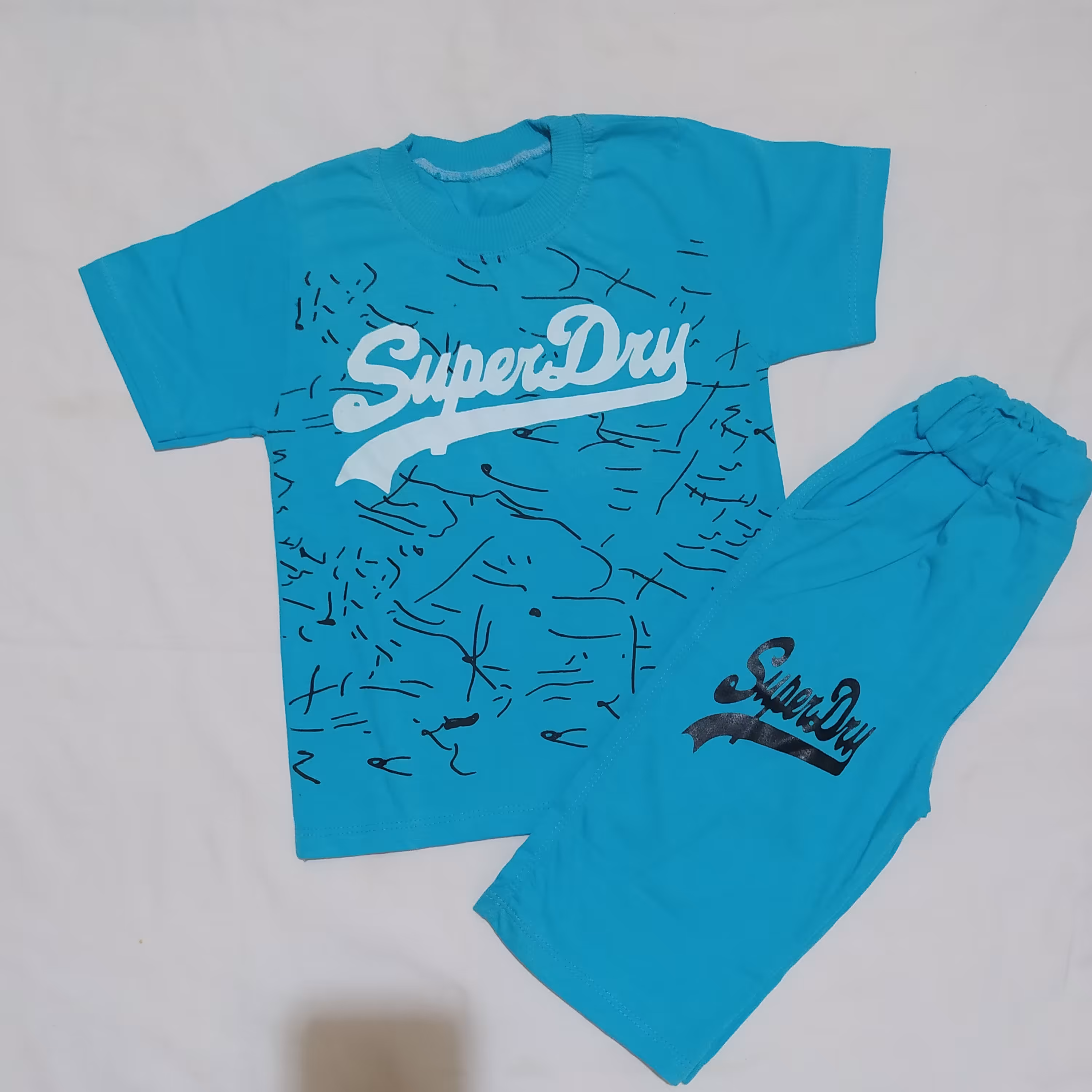 تیشرت  شلوارک پسرانه جنس پنبه دارای رنگ بندی 