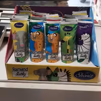 شکلات تیوپی رامند شونیز کرم کاکائویی با پوره فندق و کنجد  آجیل و خشکبار بادامک 