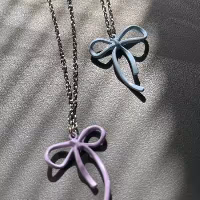 گردنبند پاپیون ترند بنفش و آبی استیل