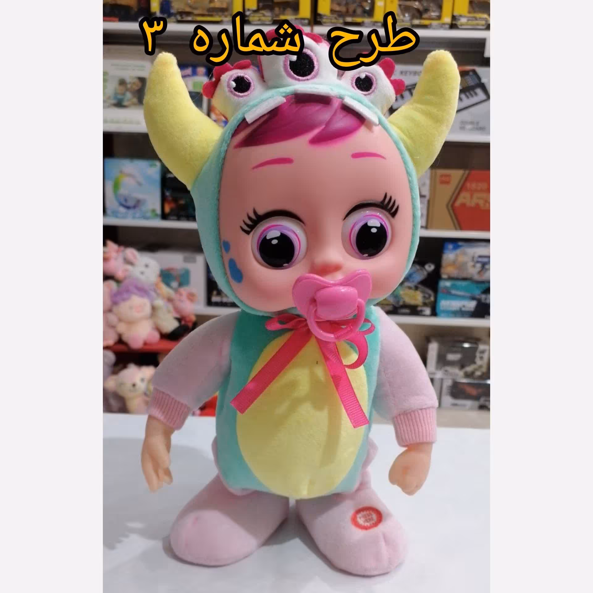 عروسک بی بی کرای چشم درشت پسونک دار موزیکال حرکتی مدل BL-224 اسباب بازی کرای بیبی