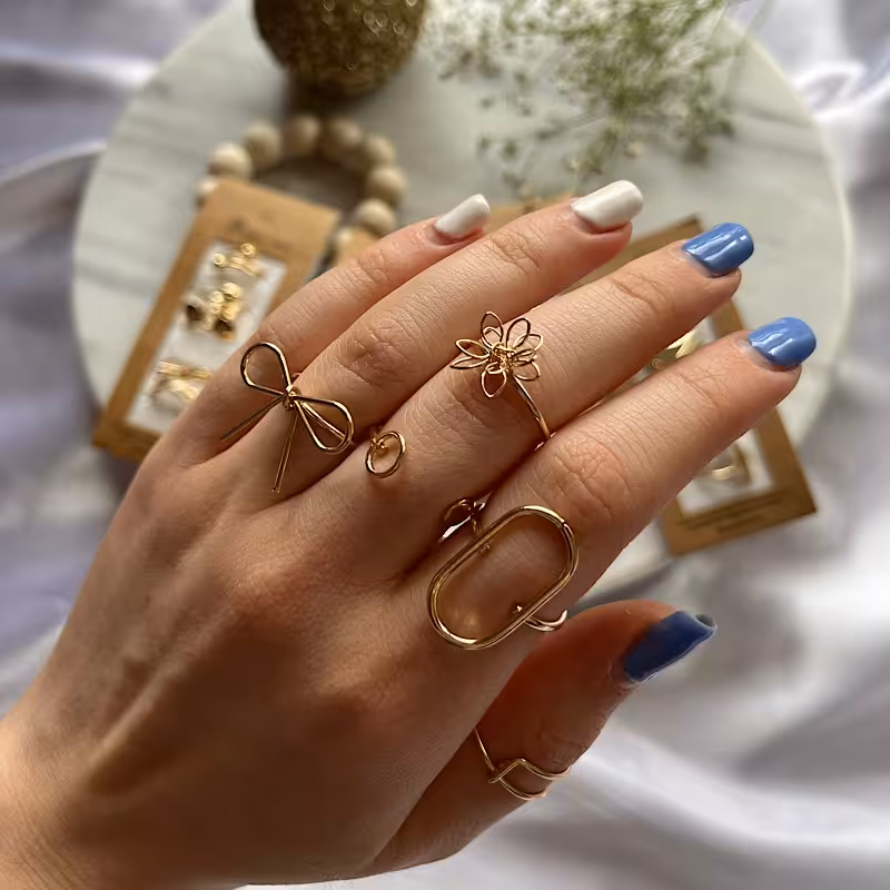 زیورالات انگشتر پک 5 تایی گل طلایی و نقره ای استیل