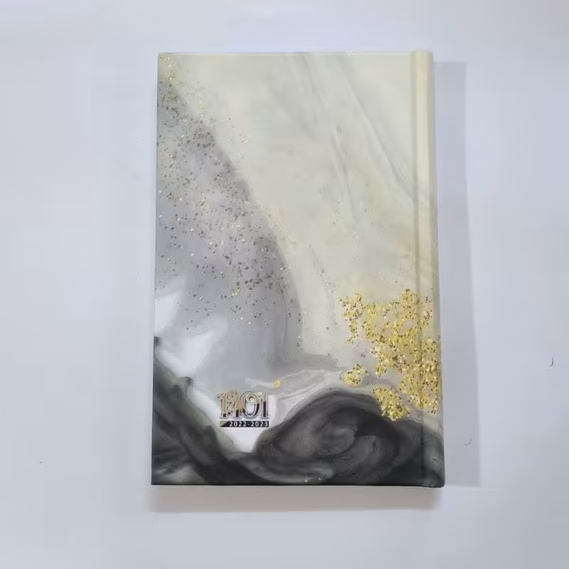 011317-سررسید و دفتر یاداشت و چک نویس سلفون اروپایی رقعی 1401-ایلیا