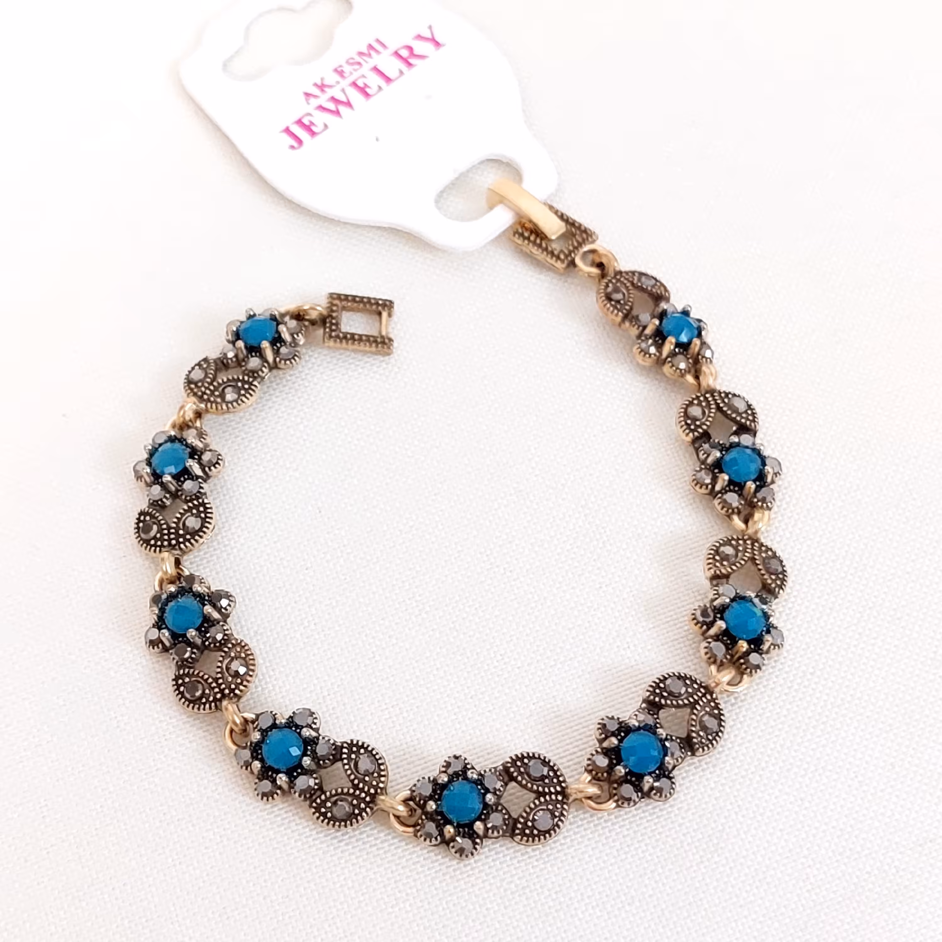 دستبند سیاه قلم نگین فیروزه ای طلایی