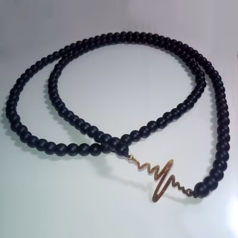 گردنبند طرح beat سنگ اونیکس مشکی پلاک استیل رنگ ثابت