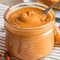 کره بادام زمینی آستانه اشرفیه بدون افزودنی400گرمی محصول 1403