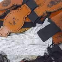 حرز دست نویس امام جواد علیه السلام روی پوست آهو به همراه بازوبند چرم طبیعی