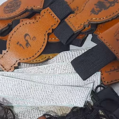 حرز دست نویس امام جواد علیه السلام روی پوست آهو به همراه بازوبند چرم طبیعی