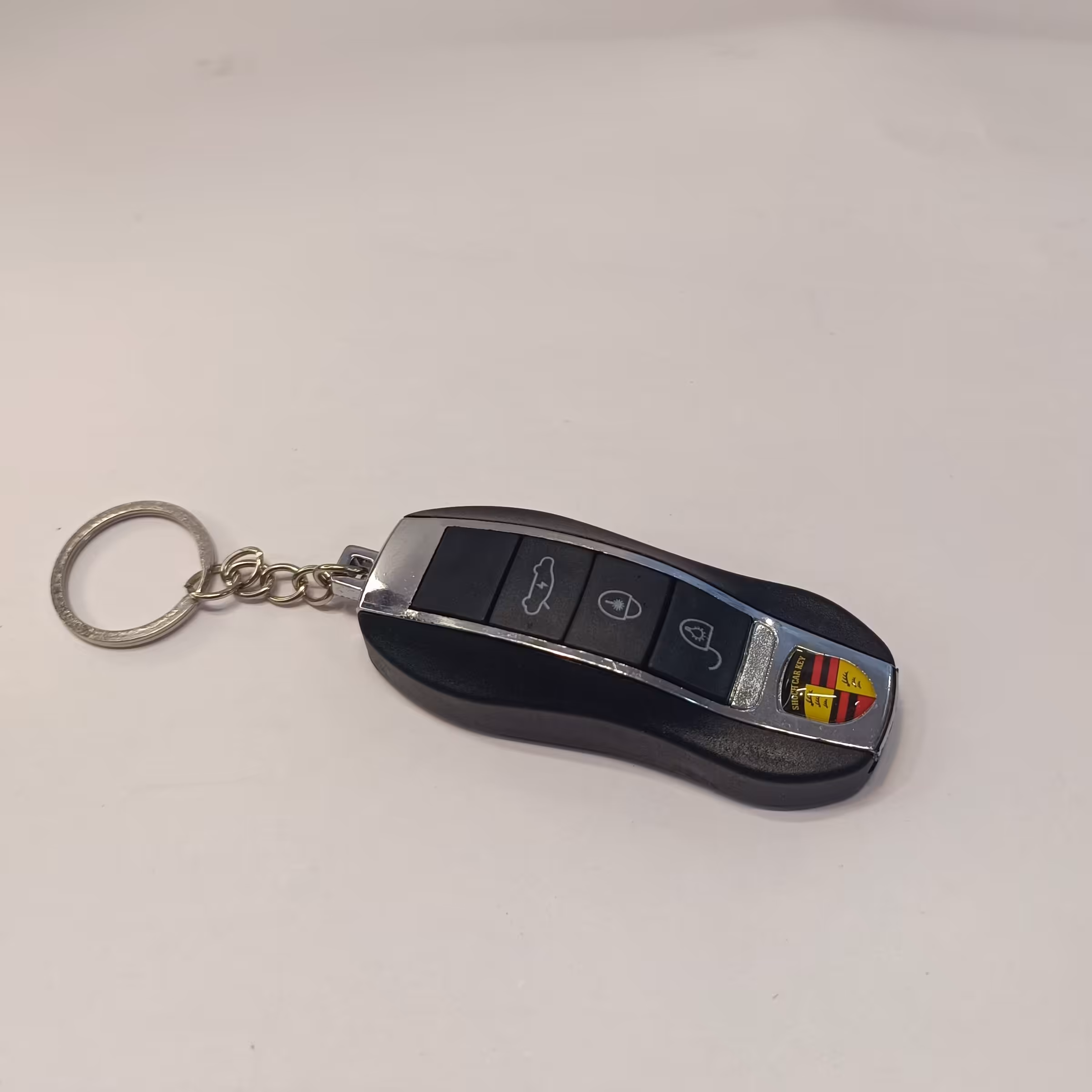 ریموت شوکر جاکلیدی ریموت شوکر دار  طرح ماشین چراغ قوه دار و لیزر دار