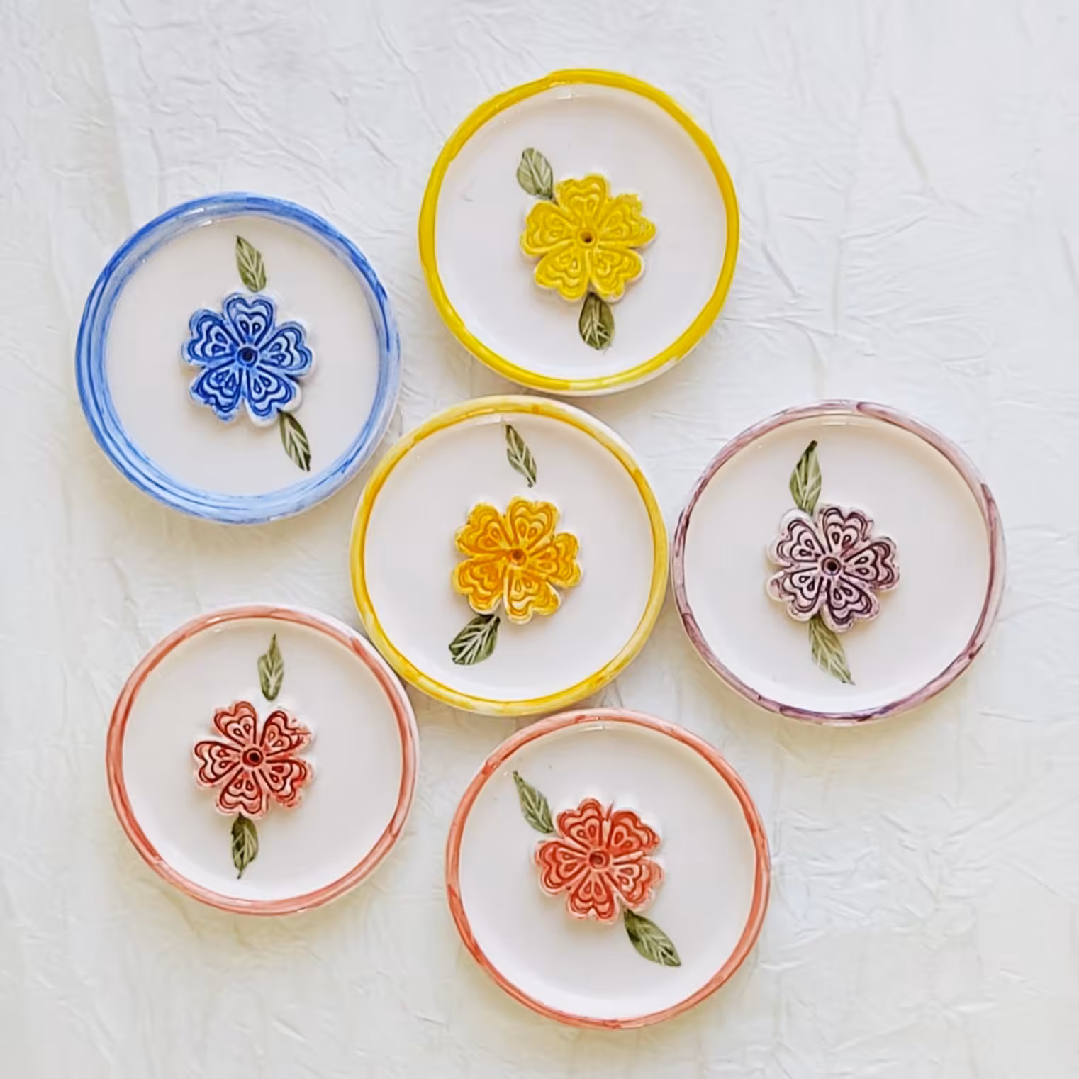 انواع جا عودی گرد طرح گل برجسته ( فروش عمده)