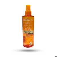 روغن آفتاب برنزه کننده بیوکسین SPF15 مناسب انواع پوست حجم 200 میل