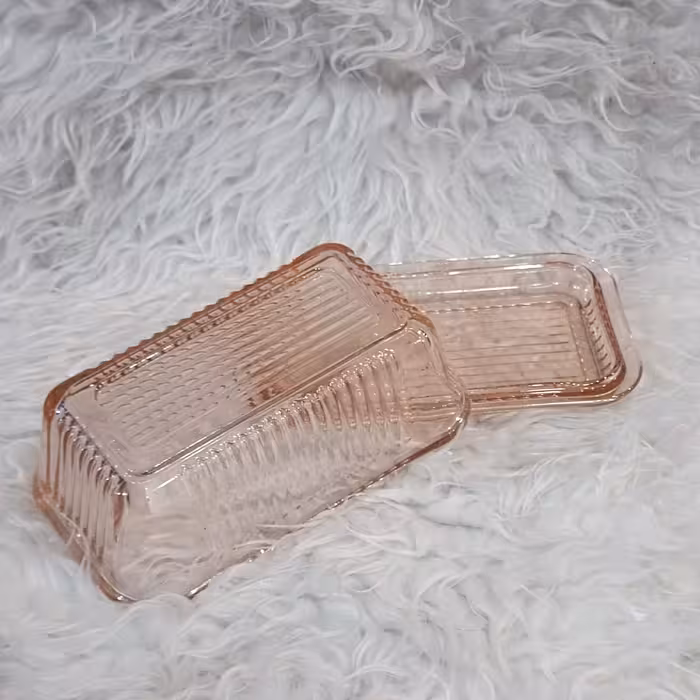 پنیر یا کره خوری شیشه ای پرشیا صورتی کاوه طول  17در 10در ارتفاع 8س 