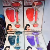 ماساژور دستی صورت جیدرولر به همراه سنگ گوشا