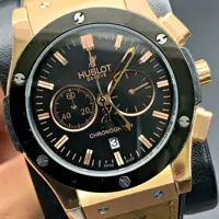 ساعت مردانه هابلوت بدنه استیل طلایی رنگ ثابت+بند رابر+سه موتوره+گارانتی دار+ hublot