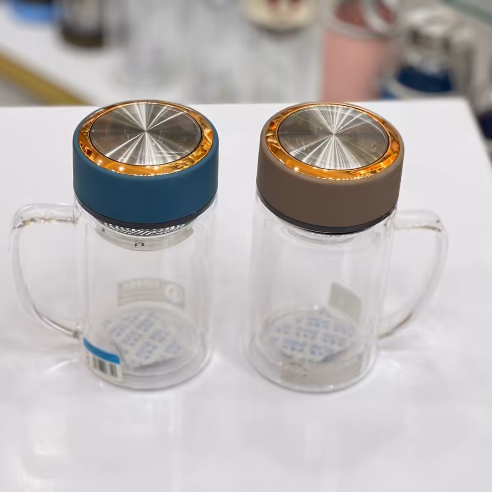 لیوان پیرکس دسته دار دوجداره مخصوص دم نوش همراه با صافی استیل 