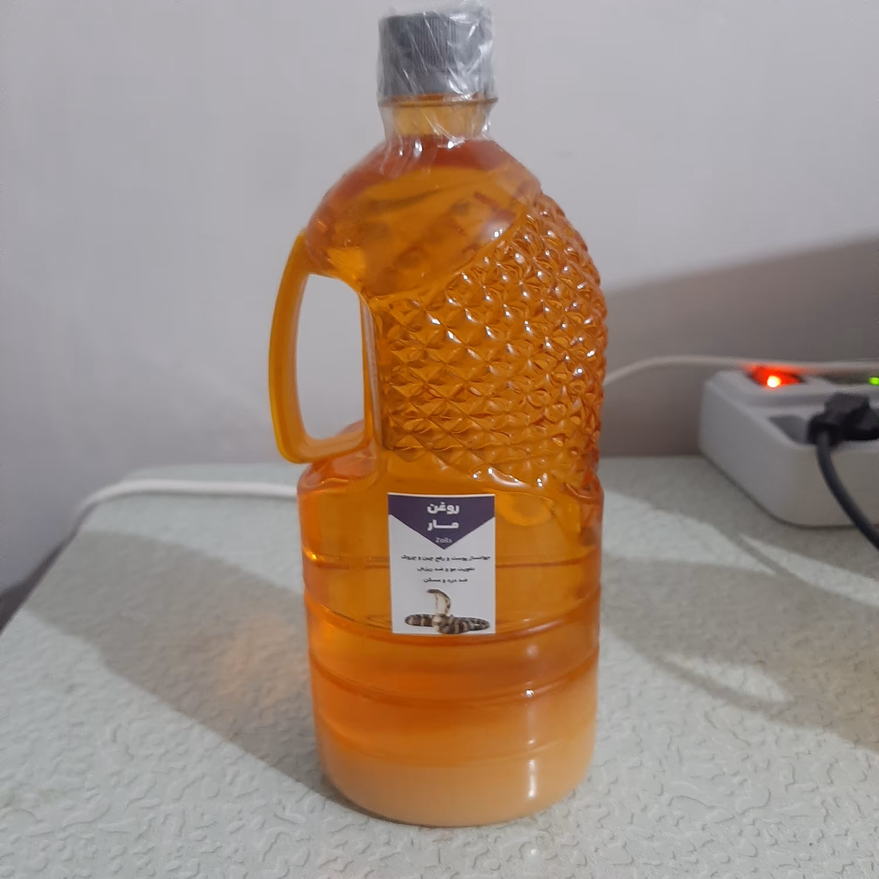 روغن مار هندی اصل وارداتی یک لیتری (پرپشت کننده مو پرپشت کننده ابرو تقویت مژه تقویت ریش و سبیل تقویت ابرو پرپشت کننده ری