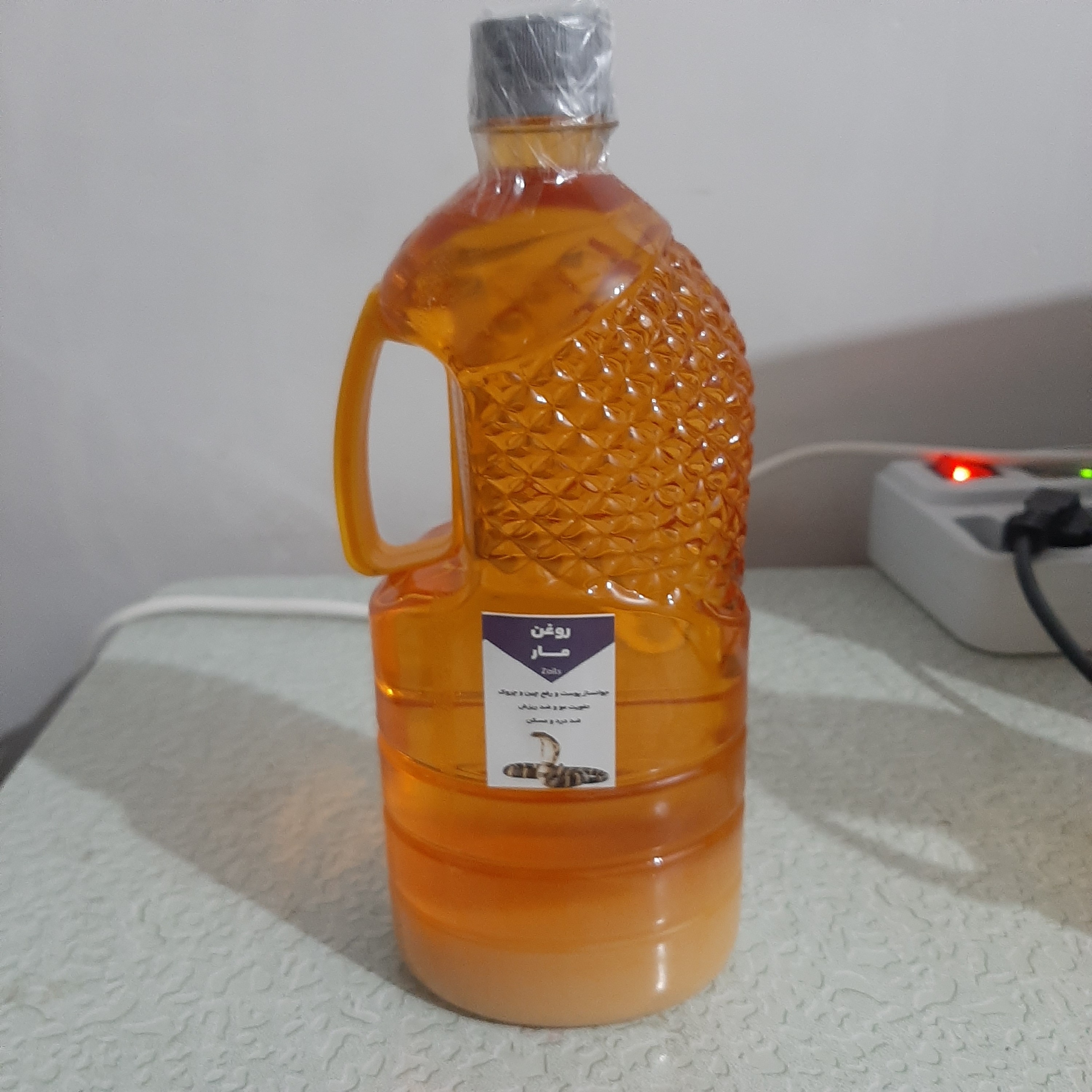 روغن مار هندی اصل وارداتی یک لیتری (پرپشت کننده مو پرپشت کننده ابرو تقویت مژه تقویت ریش و سبیل تقویت ابرو پرپشت کننده ری