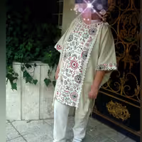 ست مانتو شلوار لینن طرح سنتی رها         جلو بسته قد 105منگوله دار 