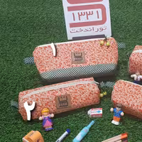 جامدادی پارچه ای در دو مدل و دو سایز گلدار ریز زمینه نارنجی