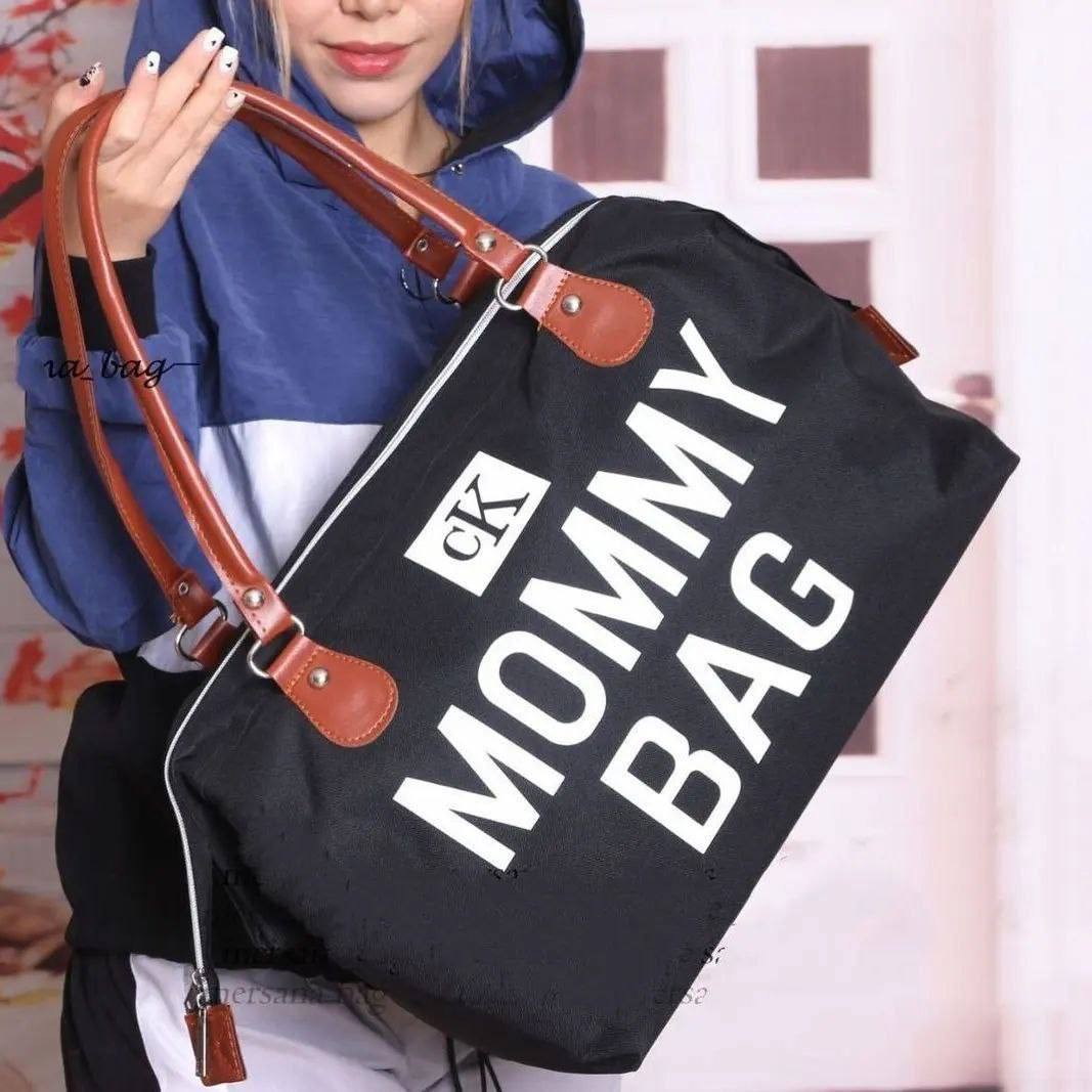 کیف MOMMY BAG ، بسیار زیبا و جذاب، در رنگ بندی مشکی، دارای بند چرمی