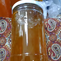 مربا بالهنگ خانگی با تکه های بالهنگ خوش طعم و عالی  وزن با شیشه 1250 گرم 