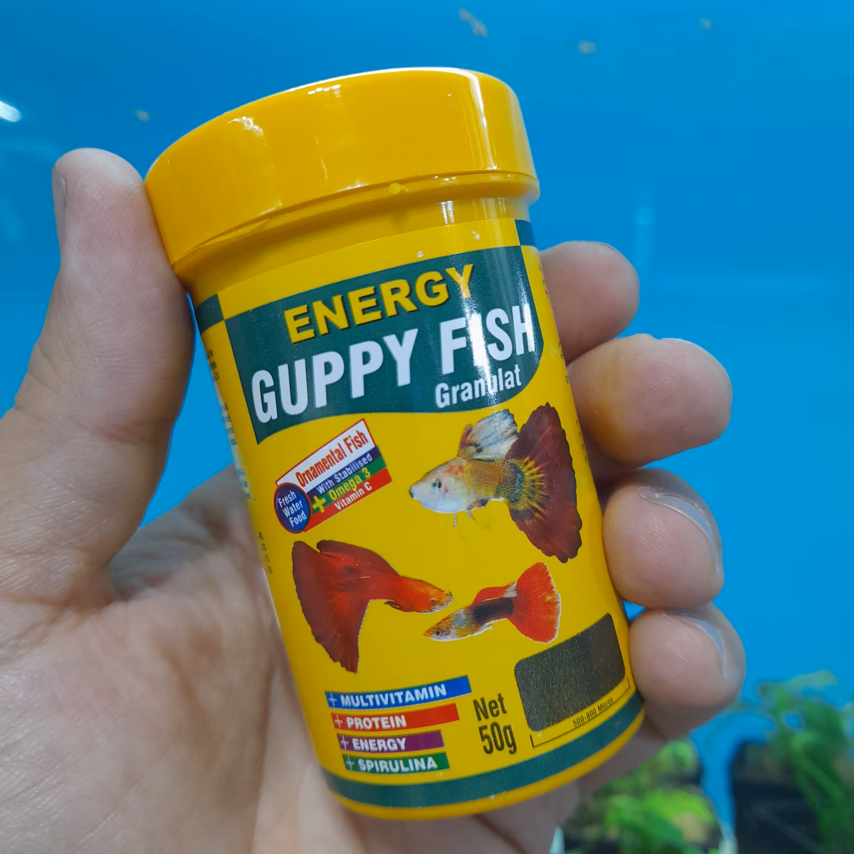 غذای ماهی آکواریوم انواع گیاه خواران (گوپی فیش گرانول) 100 میل انرژی