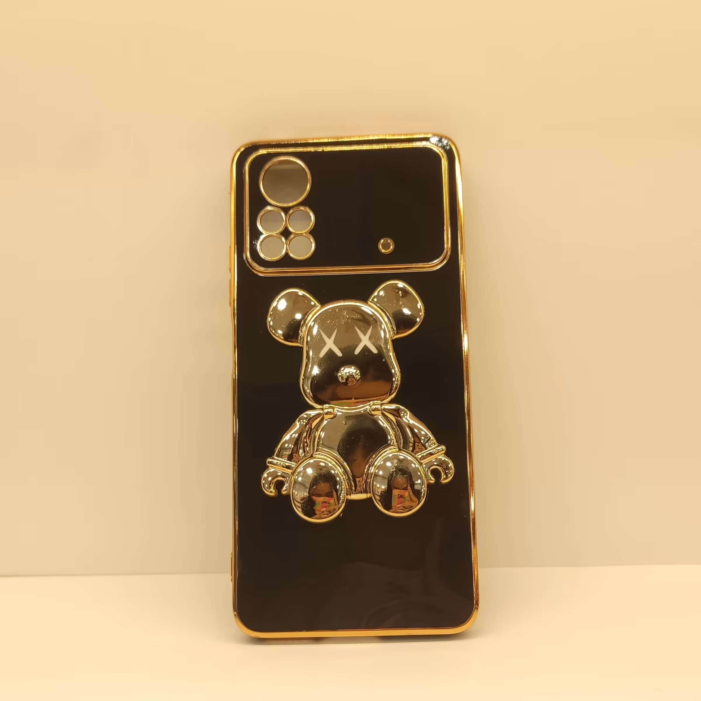 گارد گوشی مدل   x4 pro 5g  مشکی طلایی برجسته استندی