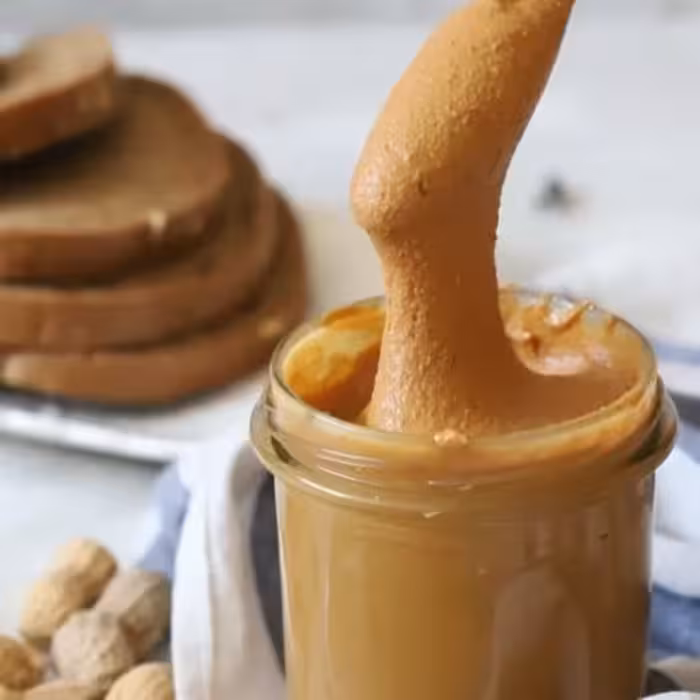 کره بادام زمینی کرانچی خالص یک کیلویی کنجدانه 