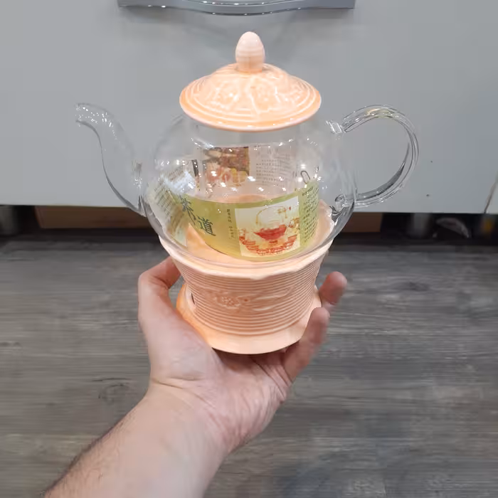 قوری پیرکس شعله مستقیم دارای صافی پیرکس و درب چینی کیفیت پیرکس ضخیم و شعله مستقیم‌با یک وارمر چینی